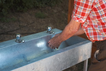 Old Man Washing his Hands