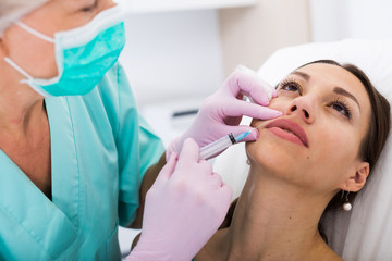 Female receiving cosmetic injection