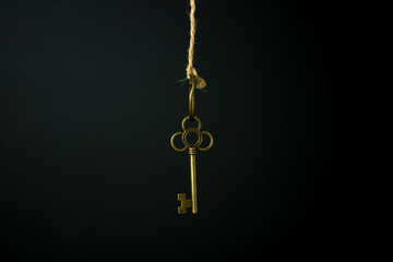 Fototapeta na wymiar Gold key hanging
