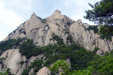 Fototapeta na wymiar Baegundae peak of Bukhansan Mountain in Bukhansan National Park, is a popular peak to climb, though is steep and exposed with chains and cables to help climbers, Seoul Korea
