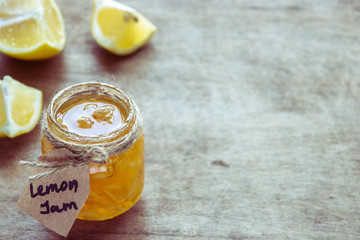 Homemade lemon jam in glass jar. Organic fresh yellow jam