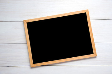 Blackboard on wooden table.