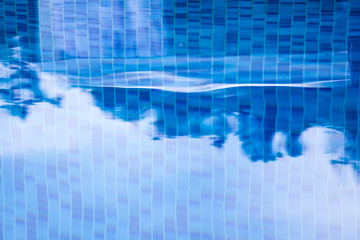 Blurred blue mosaic background.