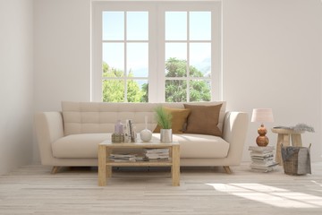 Fototapeta premium Idea of white room with sofa and summer landscape in window. Scandinavian interior design. 3D illustration