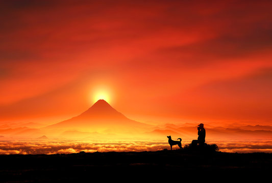 富士山の夜明けと犬のシルエット
