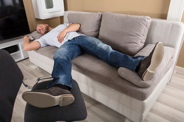 Man Sleeping On Couch