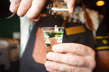 The barman pours a strong cocktail of Hiroshima