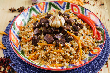 Pilaf with mutton, carrots, onions, garlic, pepper and cumin. A traditional dish of Asian cuisine.
