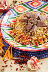 pilaf with beef, vegetables and pomegranate seeds