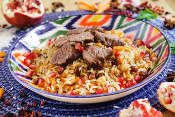 pilaf with beef, vegetables and pomegranate seeds