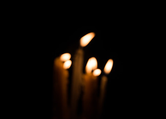 Candle on black background