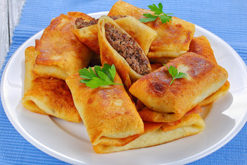 rolled up Crepes stuffed with minced liver