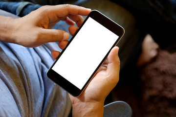 Man holding smart phone with blurred background.  For Graphic display montage.