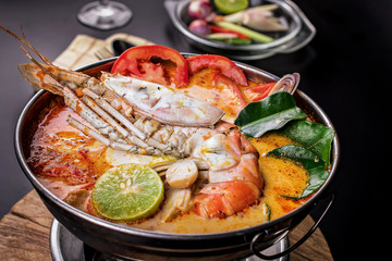 Spicy soup with shrimp in bowl , famous Thai food cuisine calling Tom Yum Kung