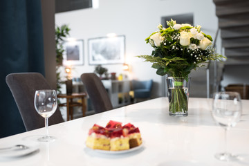 Bouquet of yellow Roses  standing on the white table in the living room 