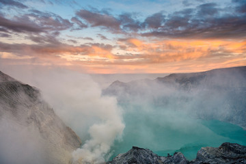 Sulfur mines at kawah ijen,indonesia.Sulfur mines view point.High angle shots.People look at sulfur mines.