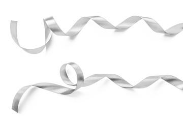 Silver ribbon bow in bright silver white grey color isolated on white background with clipping path for holiday and party greeting card design decoration element - Powered by Adobe