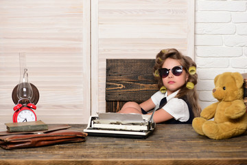 Child with briefcase and alarm clock.