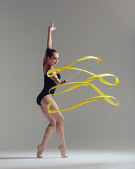 Young beautiful atglete is posing in studio