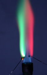 Double colored fire caused by two different elements. Lithium causes a carmine red color, and...