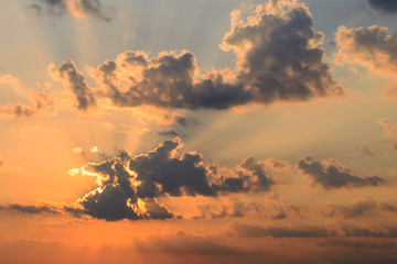 The sun coming out of the clouds at dawn