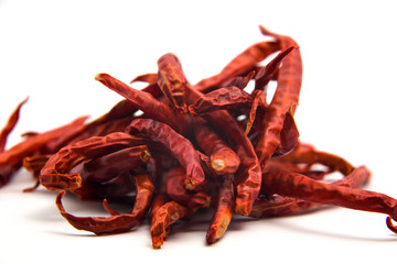 Dried chilies on a white background