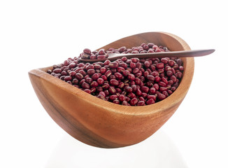Red bean in wooden bowl and spoon putting on white background