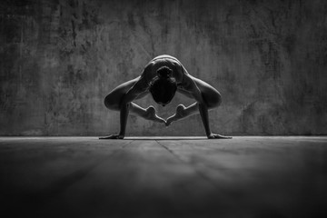 Young beautiful fitness female posing in studio