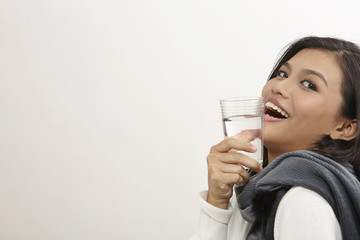 woman with glass of drinking water