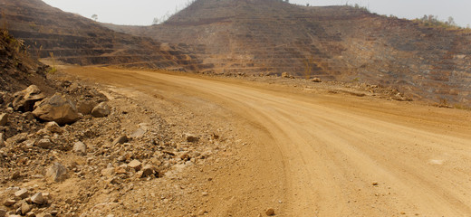 Road to zinc mine. Background of mining industrial landscape on the open pit. Opencast textured land.