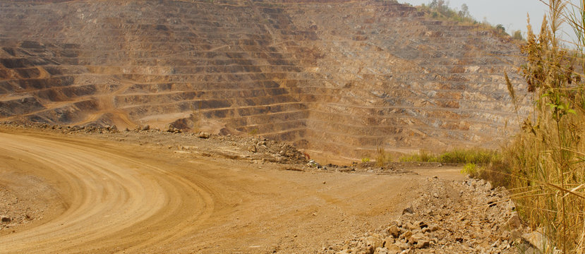 Road To Zinc Mine. Background Of Mining Industrial Landscape On The Open Pit. Opencast Textured Land.