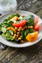 Heathy salad with tomatoes and chick pea
