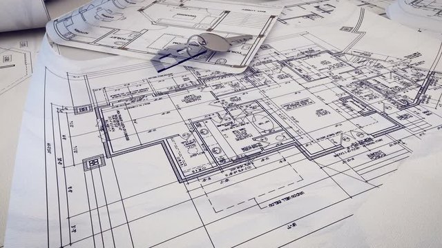 House Key falling on a blueprint.