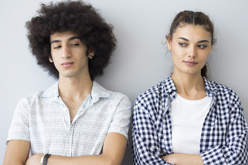 Young people standing next to each other with wicked faces