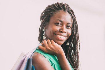 Happy African American woman with shopping bags