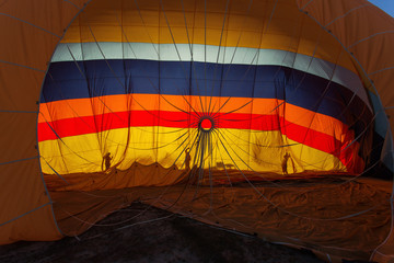 Men gathering the balloon after landing in Cappadocia, Turkey