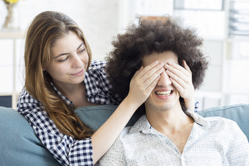 Young people playing guess who game