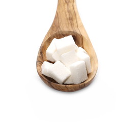 White sugar cubes in wooden spoon isolated on white background 