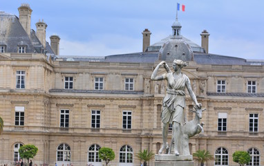 Fototapeta premium The senate and the statue in the garden of Luxembourg, Paris, France,