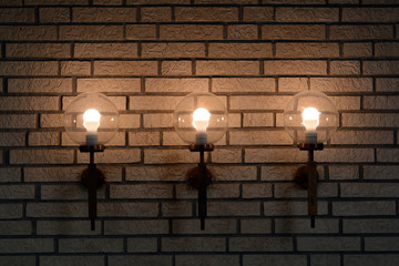 Fototapeta na wymiar Lamps in brick wall