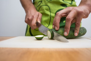 Obraz na płótnie Canvas man cutting vegetables