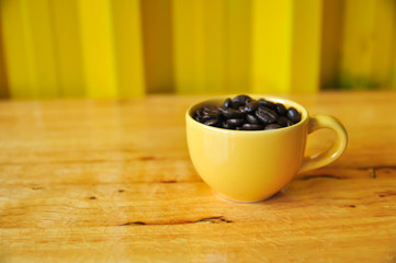 Cup full of coffee beans