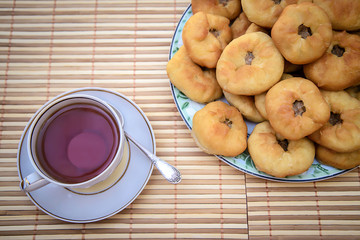 Tea and round cakes with meat, tatar peremyach