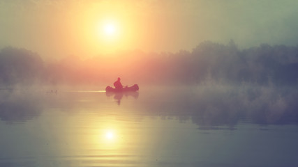 Fishing. A misty morning in a boat.