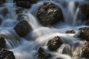 Creek with Rocks and Sun