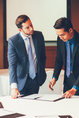 Two Serious Adult Business Men Discussing Contract