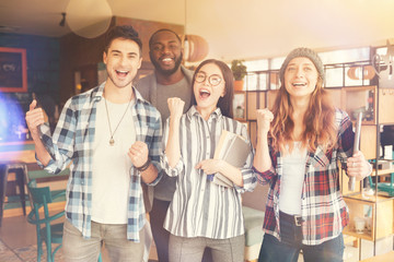 Overjoyed students standing in the cafeteria
