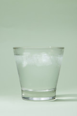 Cold fresh drinking water in glass on table