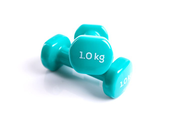 Two small green dumbbells