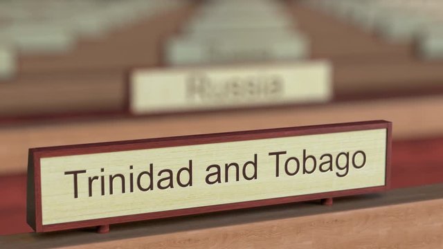 Trinidad and Tobago name sign among different countries plaques at international organization. 3D rendering